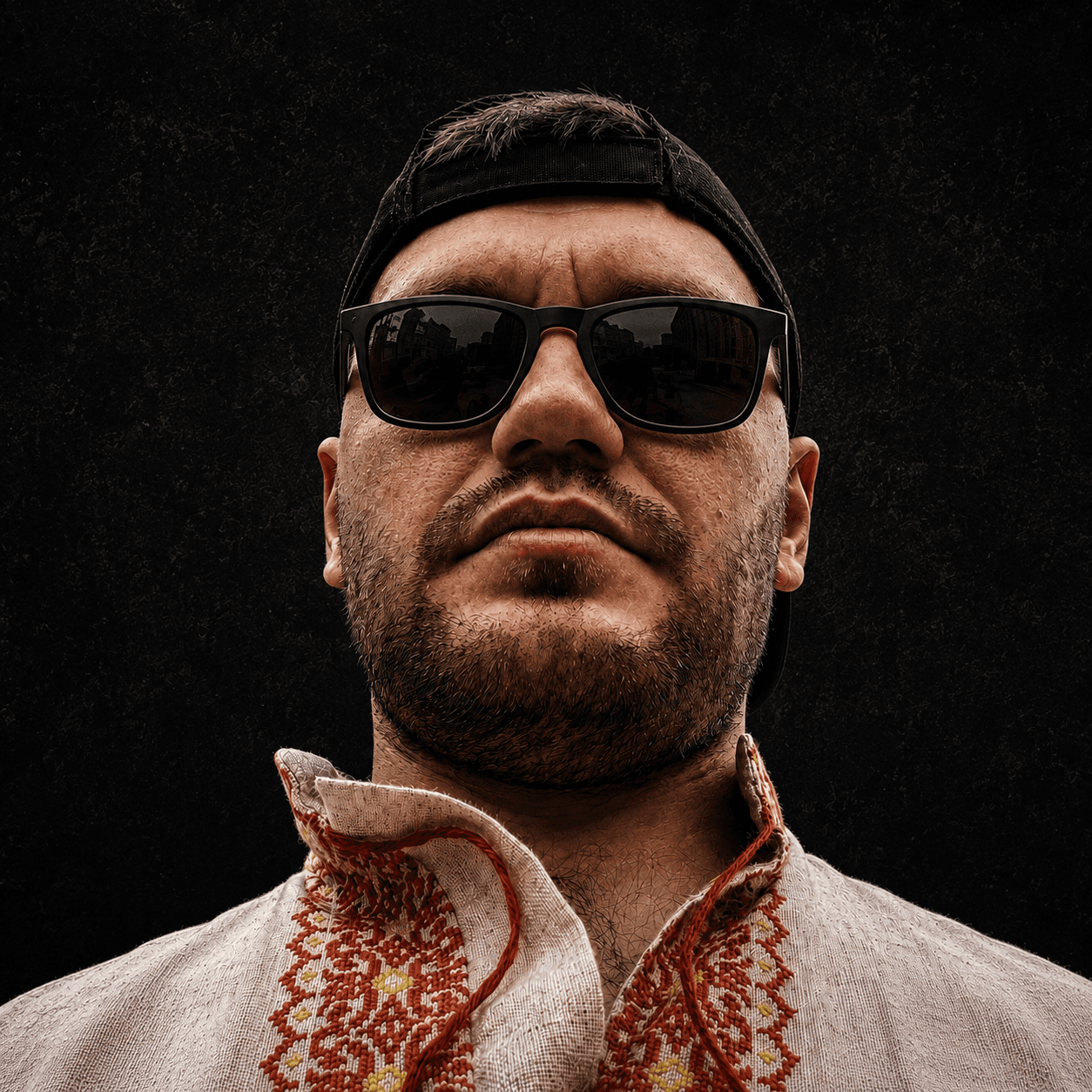 Serhii Samborskyi wearing sunglasses and an embroidered Ukrainian shirt